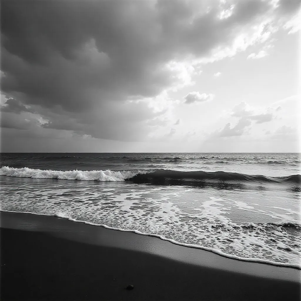 Serene Monochrome Seascape: Waves Under Expansive Sky