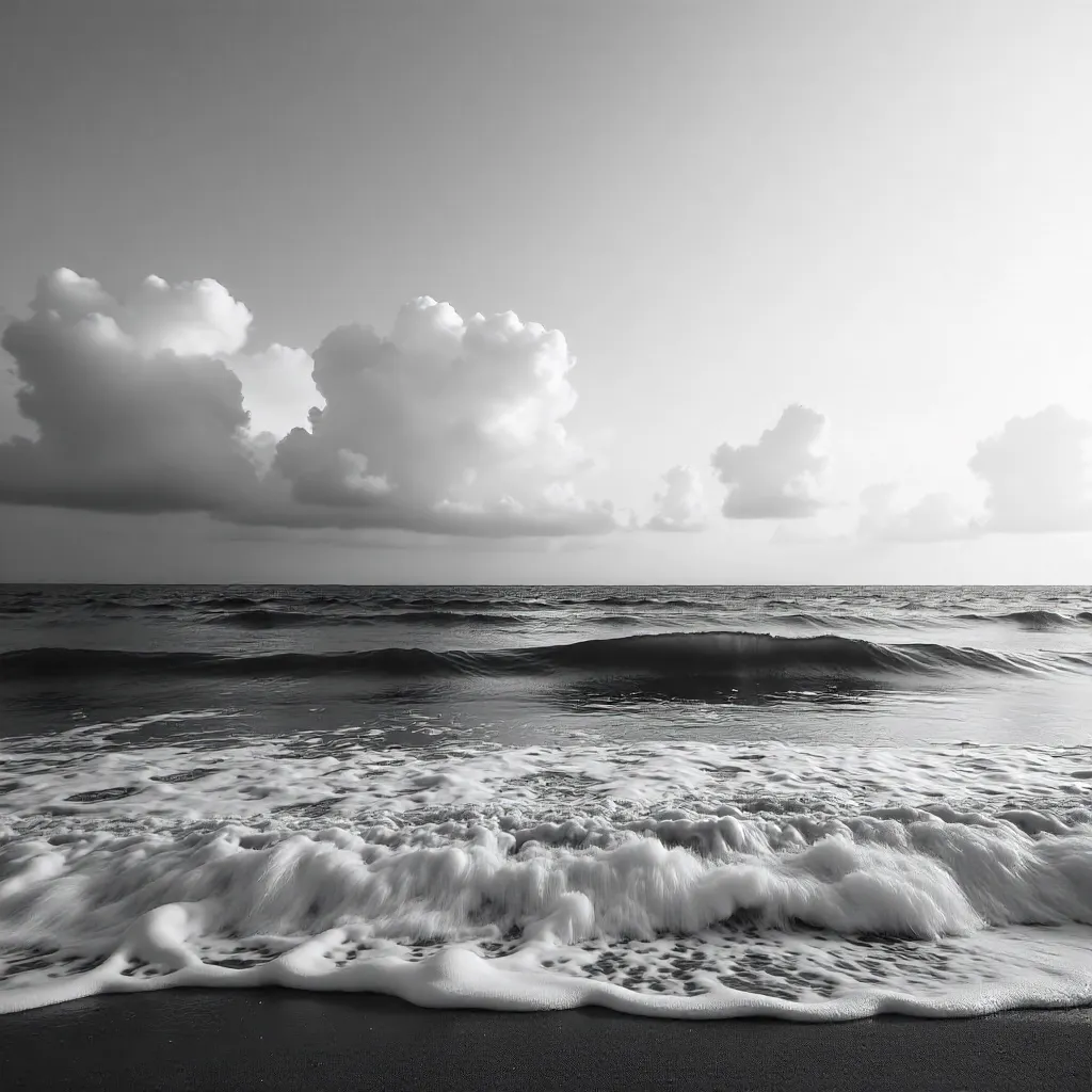 Expansive Sky Over Serene Black-and-White Seascape