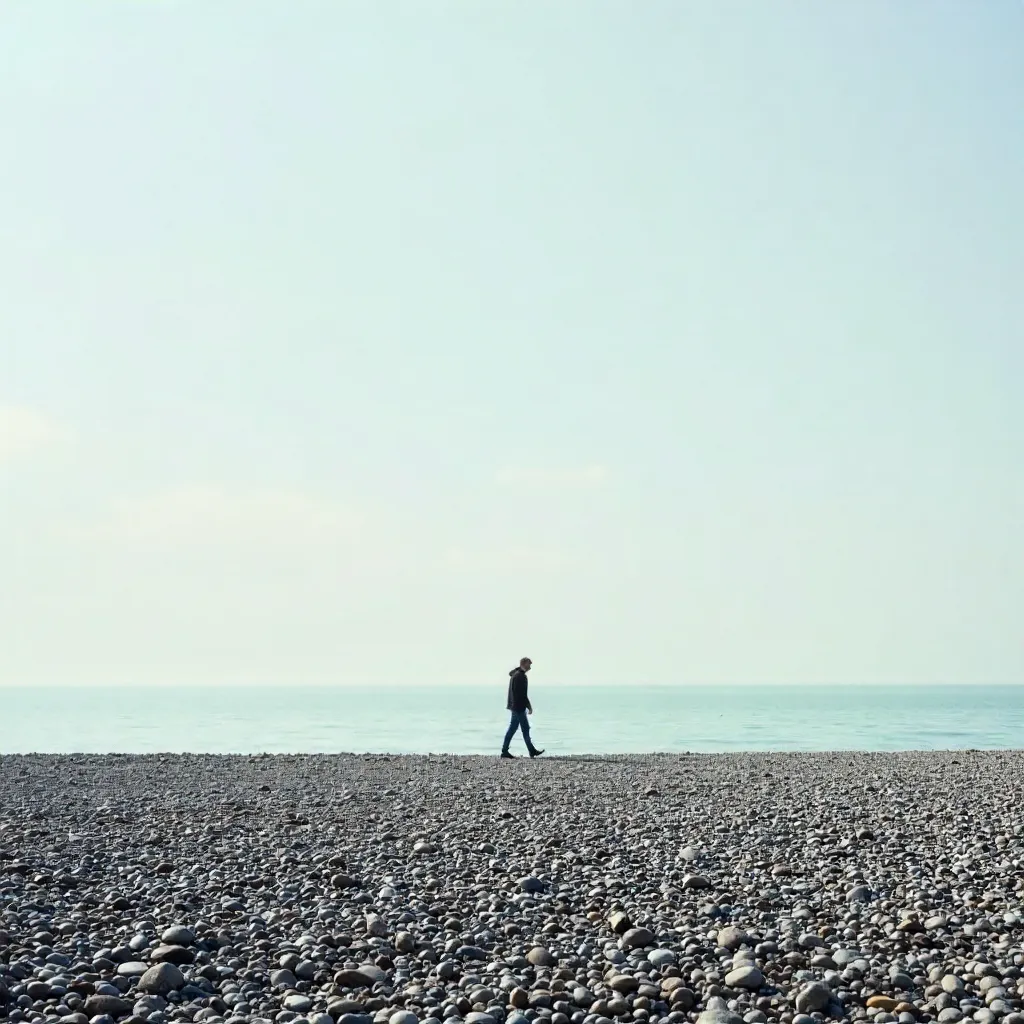 Lone Walker on Brighton Pebble Beach