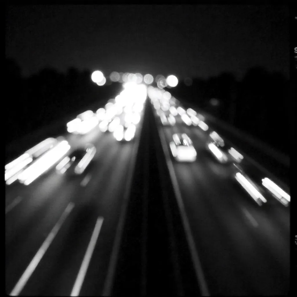 Noir Blur: Highway Light Trails in Monochrome