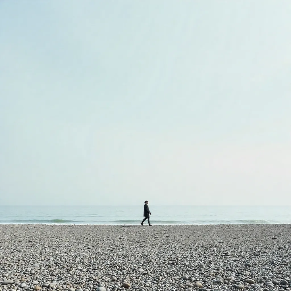 Lone Walker on Brighton Pebble Beach
