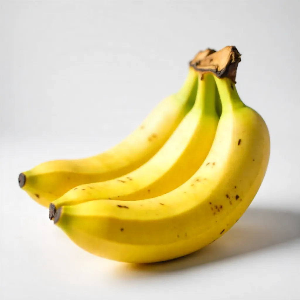 Macro Close-Up: Fresh Ripe Bananas on White Backdrop
